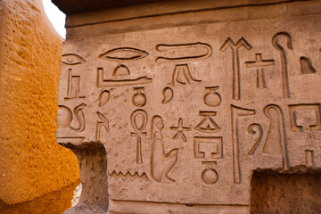 Beautiful ancient egyptian symbols and hieroglyphics carved at Kom Ombo temple in Aswan 