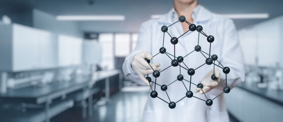 Scientist renders a crystal lattice on the background of a laboratory.