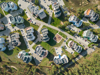 The concept of luxury living. The concept of travel. Top view of a colorful elite village. Colorful houses on the seashore. Bright morning view. Aerial photography. Bird's-eye view.
