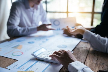 business group  point to the graph chart and use a calculator to calculate , finance cost accounting concept.