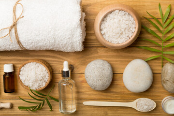 Composition with spa products on wooden background, top view