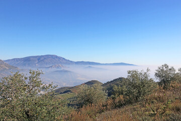 Fototapeta na wymiar Coastal mountains of Andalucia in the mist