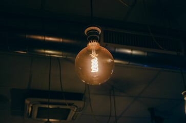 Retro tungsten lightbulb in a coffe shop