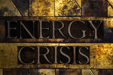 Energy Crisis text on grunge textured copper and gold background
