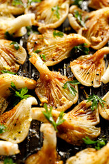 Close-up view of oyster mushrooms with marinade of soy sauce, spices and parsley, focus on the mushroom inside