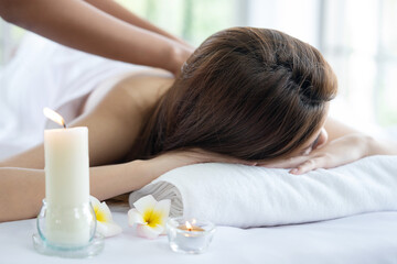 Obraz na płótnie Canvas Asian Woman Having Back Massage in a Spa