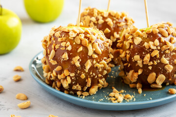 Homemade Halloween Candy Taffy Apples on a Plate, side view. Close-up.