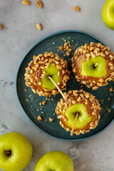Homemade Halloween Candy Taffy Apples on a Plate, top view. Flat lay, overhead, from above.