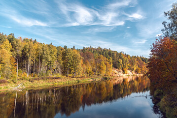 Landscape view of red sandstone caves on Gauja river in Sigulda, Latvia on a autumn day