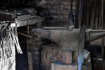 A hammer and a metal object in the forge