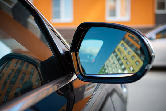 Anti-glare rearview mirror on a black car.