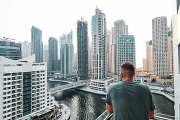 Man tourist is enjoying sightseeing in Dubai in United Arab Emirates