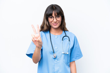 Young caucasian nurse woman isolated on white background smiling and showing victory sign