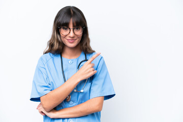 Young caucasian nurse woman isolated on white background pointing to the side to present a product