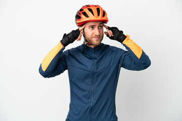 Young cyclist man isolated on white background having doubts and thinking