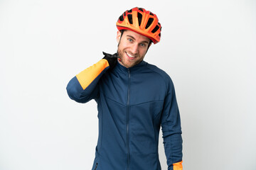 Young cyclist man isolated on white background laughing
