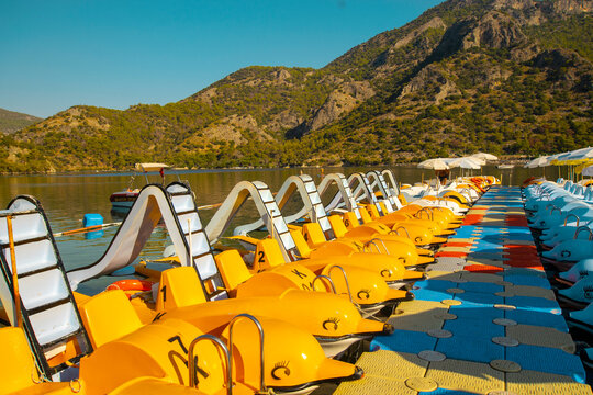 Children's Pleasure Boats At The Pier In The Lagoon.