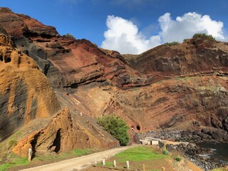 Porto Afonso, originally designated as Afonso do Porto, a fishing port on the island of Graciosa. Azores islands. Cliffs in various shades.