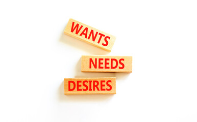 Wants needs and desires symbol. Concept words Wants Needs Desires on wooden blocks. Beautiful white table white background. Business, psychological wants needs and desires concept. Copy space.