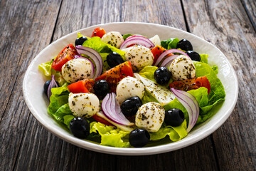 Mozzarella salad on wooden board
