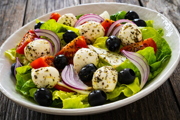 Mozzarella salad on wooden board
