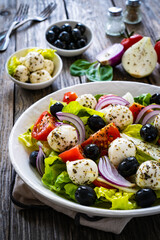 Mozzarella salad on wooden board
