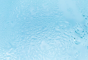 A glass with condensation on a rainy day,background