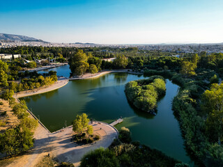 Fototapeta na wymiar Aerial photo of the lake at the Tritsi Park in Agioi Anargiroi area of Athens, Greece