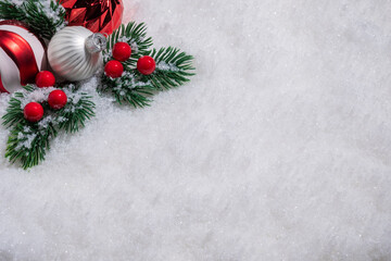 Fototapeta na wymiar Red and White Christmas balls on snow.