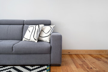 grey couch with pillows in living room