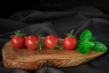 red  tomatoes branch on table  background, healthy food