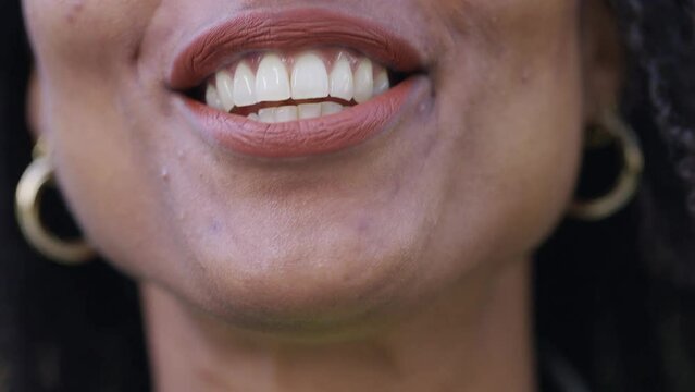 Close up of female mouth talking directly to camera 