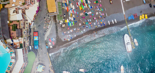 Overhead aerial view of Positano Beach on a beautiful summer day.