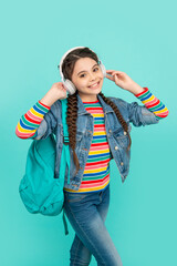 Happy teen girl listening to music, education. Informal education. School education