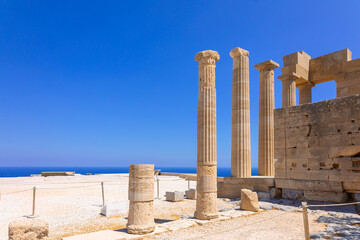 Panoramic view of ruins of ancient city of Lindos on colorful island of Rhodes, Greece. Famous...