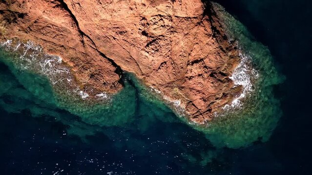 Sea waves crashing against the rocks on the coast of Mediterranean Sea between Cannes and Saint Raphael. Provence-Alpes-C&ocirc;te d'Azur region in the south of France. French Riviera