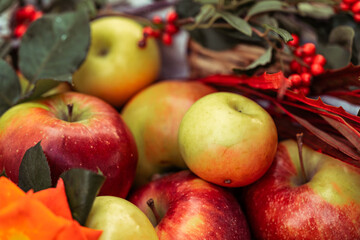 beautiful colourful autumn decoration of apples, leaves and flowers, healthy food, fresh harvested fruit