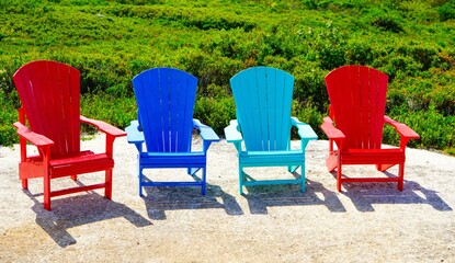 Adirondack chairs near a garden in Nova Scotia, Canada
