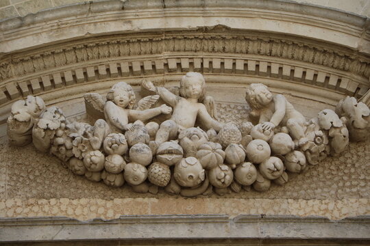 Putti at Lecce Cathedral at night, Italy