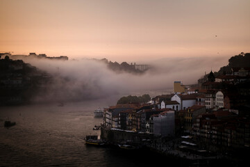 Fog over the Douro River, in the twilight light, Porto, Portugal..