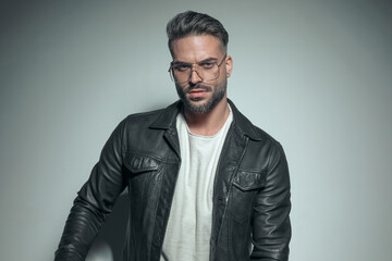 attractive casual man posing with a tough look