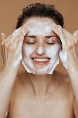 happy woman washing face