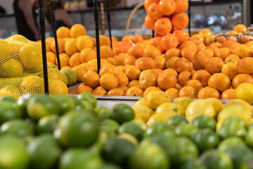 Fresh oranges in the supermarket. Vegetables and fruits exposed for the consumer to choose