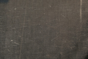 Background of a black awning in close-up. The texture of an old worn tarpaulin. The tent tarpaulin...