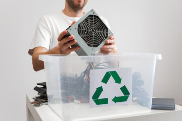 Hazardous E-Waste Recycling. Household electrical and scrapped electronic devices in recycle box....