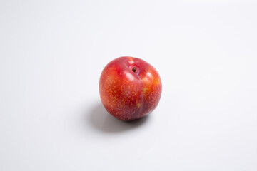Fototapeta na wymiar red plum isolated on a white background