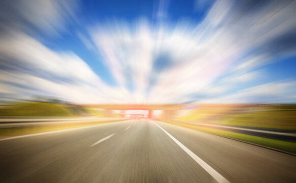 The concept of speed and focus. Motion effect. Empty highway