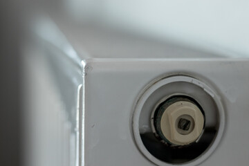 A close up of a white Heating radiator