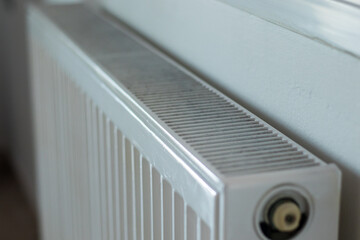 A close up of a white Heating radiator