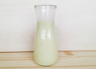 Brazilian avocado smoothie on a wooden background